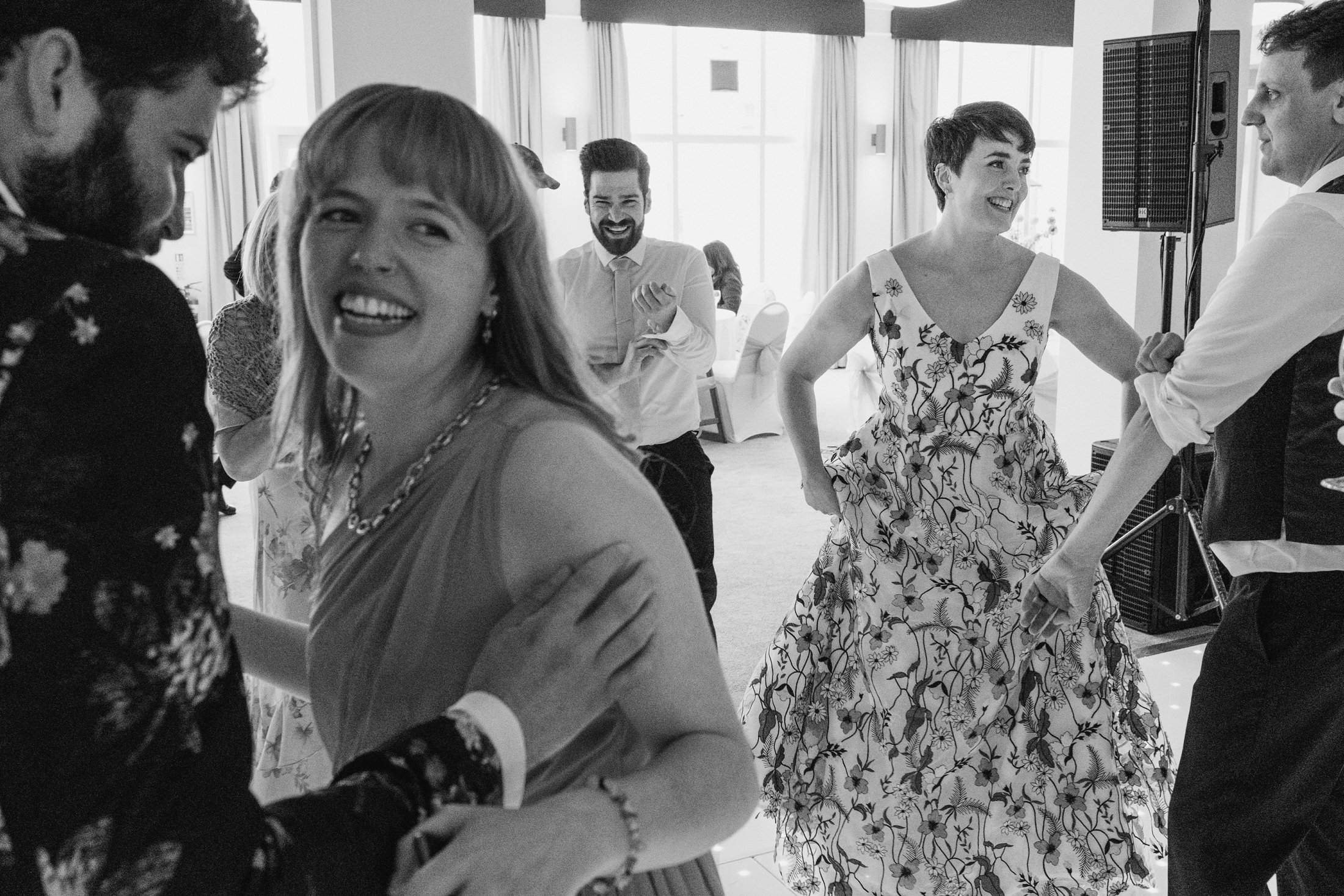 Wedding guests dancing and smiling