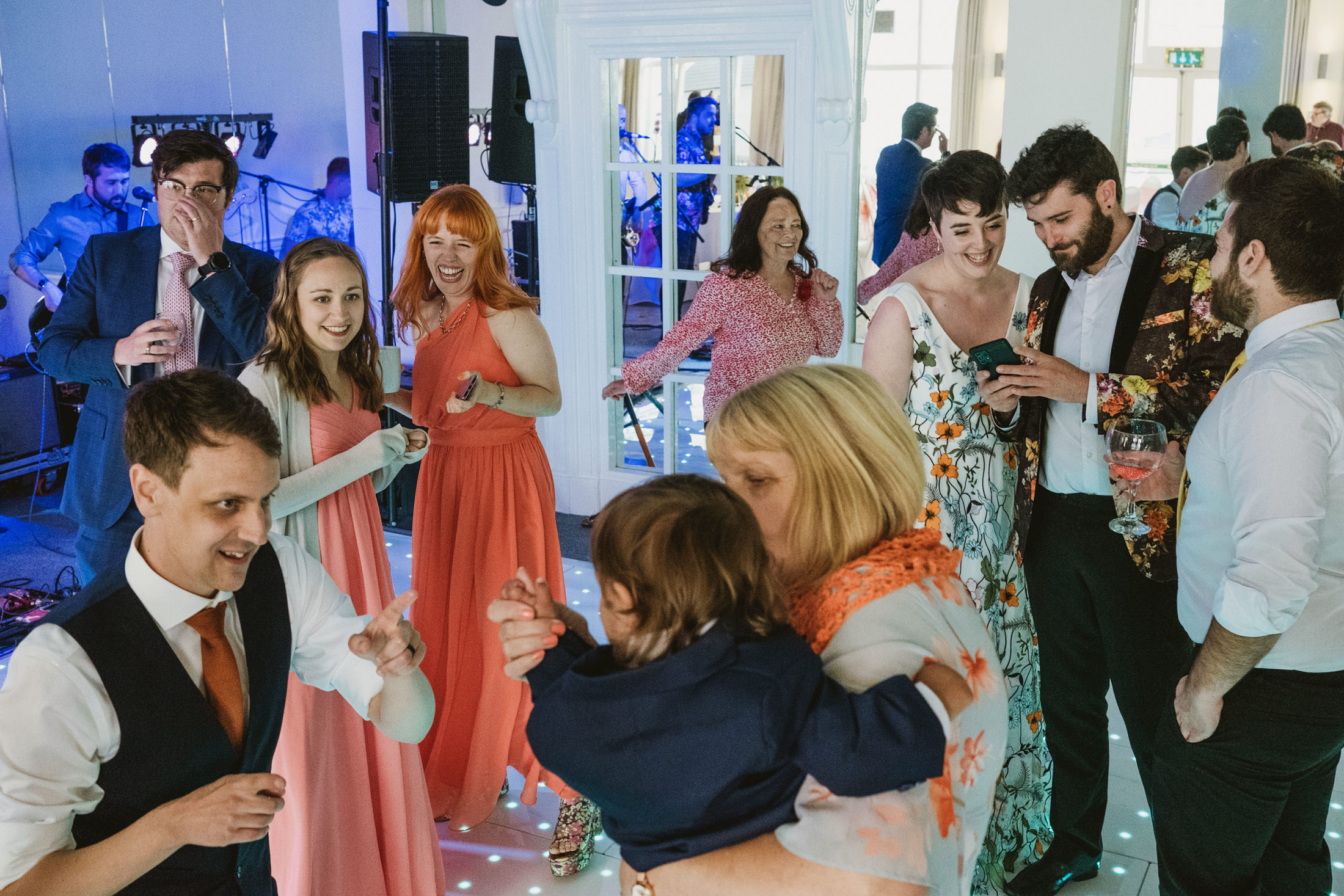 People enjoying a wedding dance party.