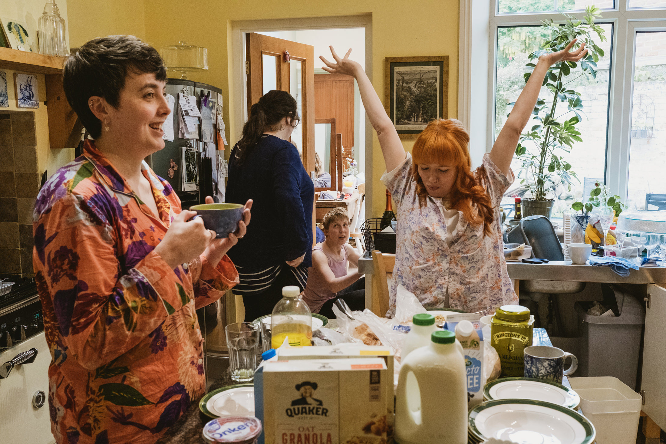 People enjoying breakfast together in a kitchen.