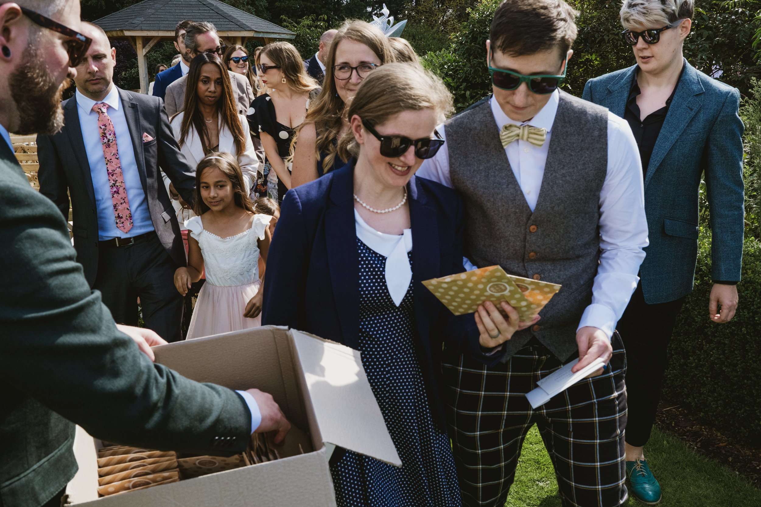 Outdoor gathering with smartly dressed people